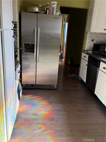 a view of a refrigerator in kitchen