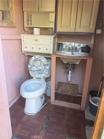 a bathroom with a toilet and a sink