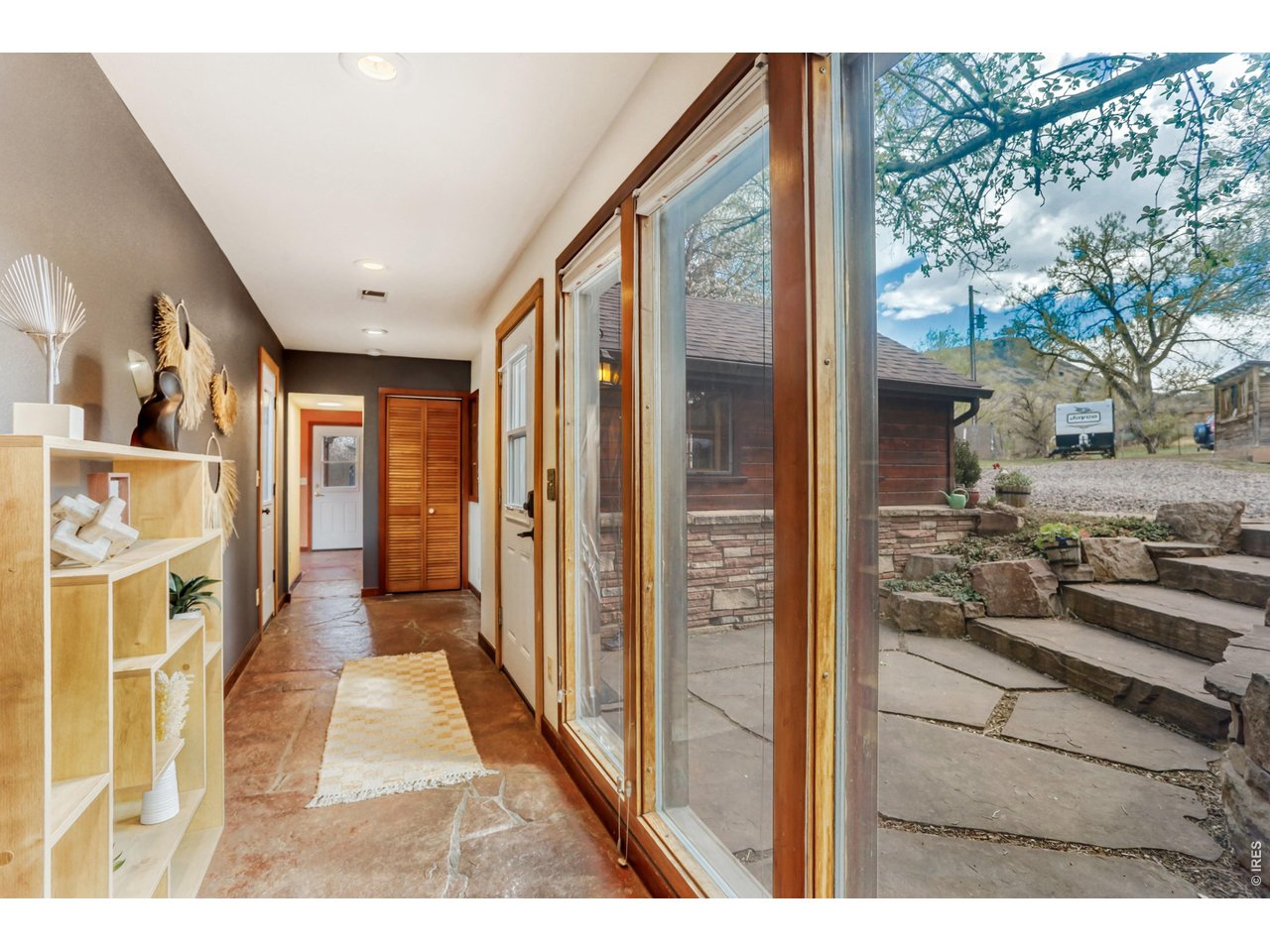 11 Red Gulch Road Lyons, CO 80540 - Photo 14 of 47 Gorgeous sandstone foyer that absorbs heat in the winter and stays cool in the summer due to the tree coverage