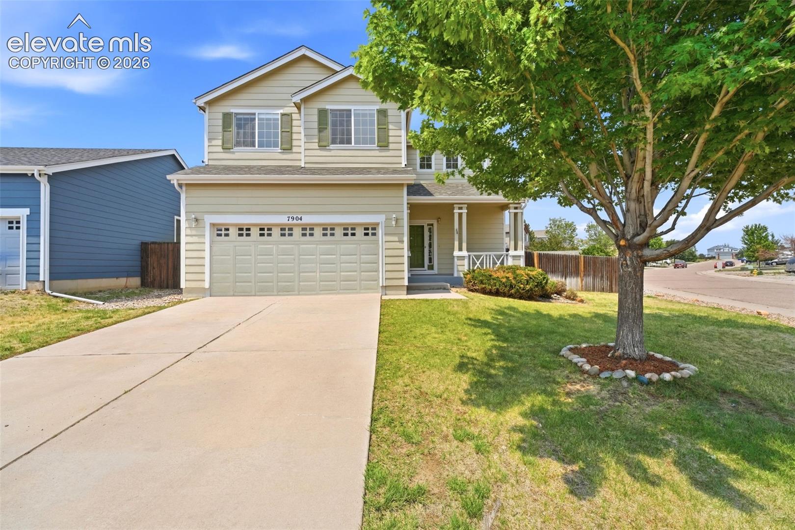 7904 Coffee Road Peyton, CO 80831 - Photo 1 of 48 Two-story residence featuring light-colored siding and green shutters