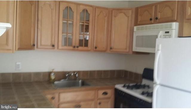 316 Franklin Road Glassboro, NJ 08028 - Photo 2 of 16 a kitchen with a cabinets and appliances