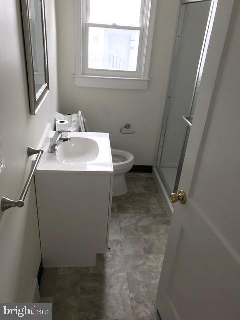 316 Franklin Road Glassboro, NJ 08028 - Photo 3 of 16 a bathroom with a sink toilet and a mirror