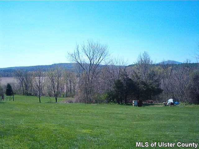 2393 Route 209 Stone Ridge Stone Ridge, NY 12484 - Photo 1 of 1 a backyard of a house with lots of green space
