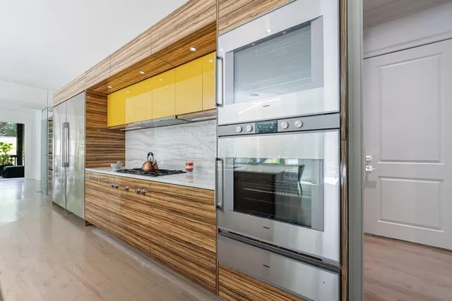 a view of a dining table and chairs in a room
