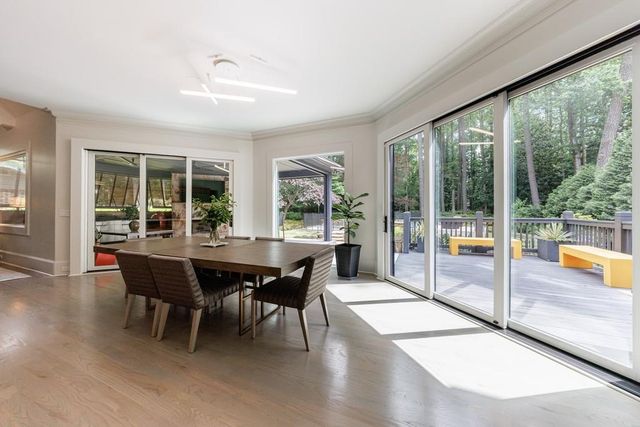a living room with furniture a fireplace and a table