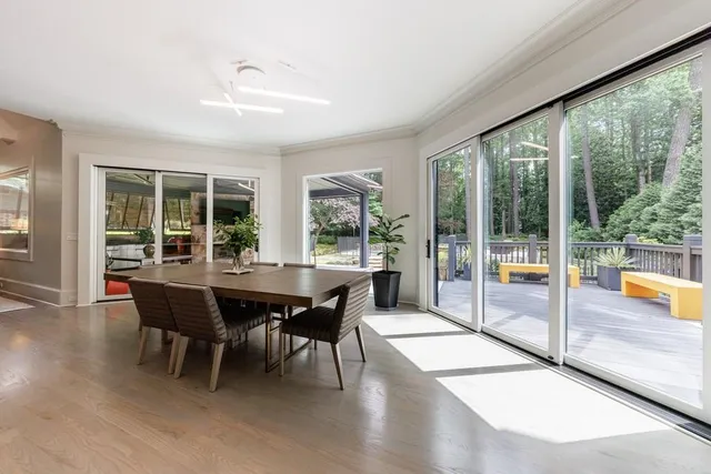 a living room with furniture a fireplace and a table