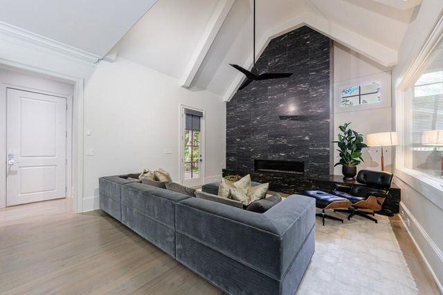 a bathroom with a double vanity sink toilet and shower