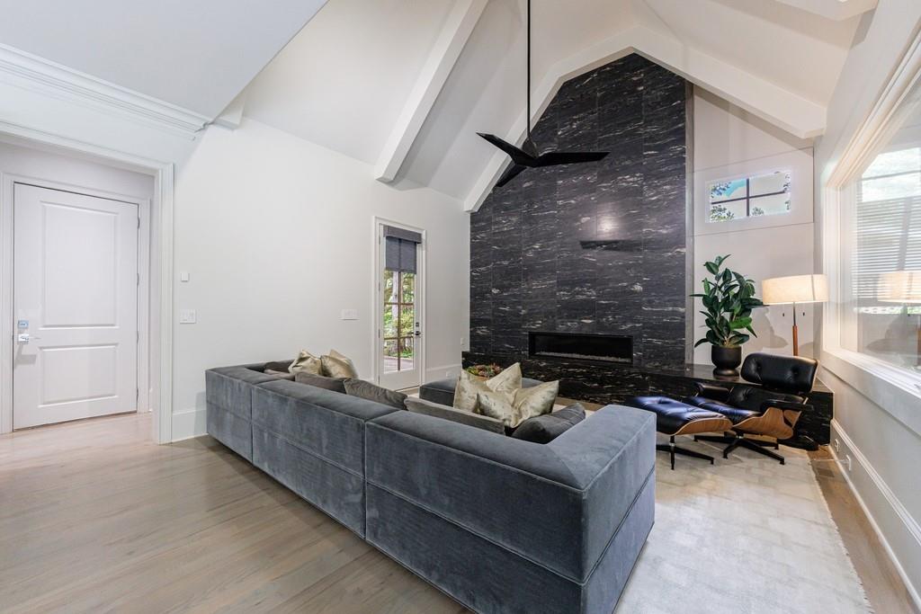 3117 West Roxboro Road Northeast Atlanta, GA 30324 - Photo 27 of 78 a living room with furniture and a fireplace