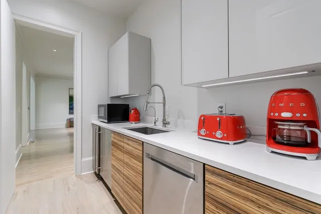 a spacious bedroom with a bed and a table