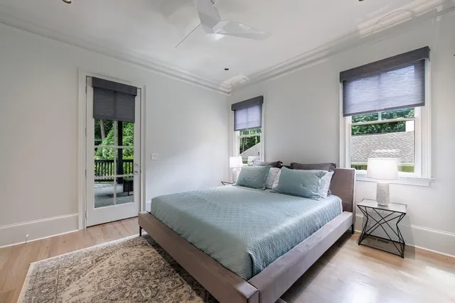 a kitchen with stainless steel appliances granite countertop a sink and a stove with wooden floor
