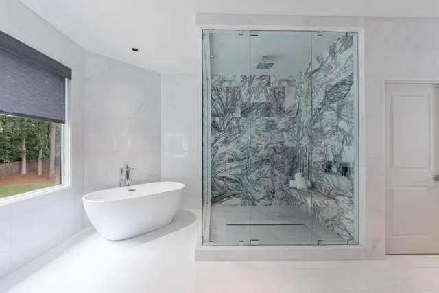 a bathroom with a sink and a large mirror