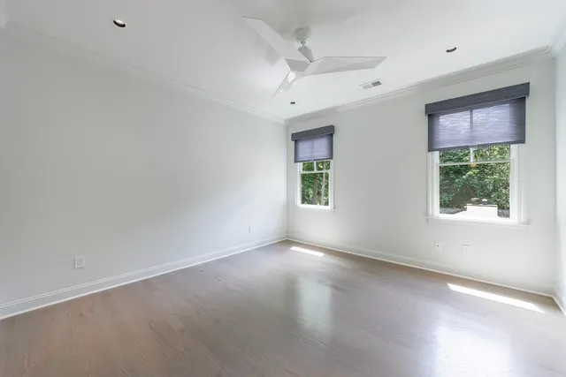 a front view of a house with swimming pool and porch