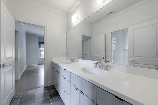 a view of a house with swimming pool and sitting area