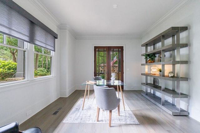 a view of a dining room with furniture window and outside view