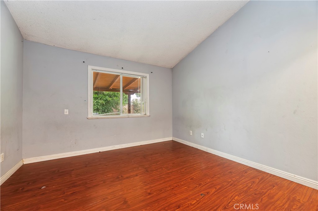 1959 Thornton Street Riverside, CA 92507 - Photo 16 of 26 a view of empty room with wooden floor and fan