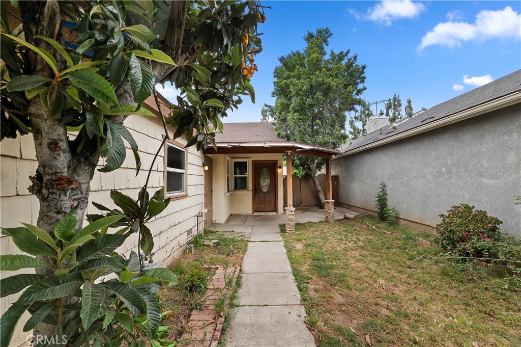 1959 Thornton Street Riverside, CA 92507 - Photo 4 of 26 a front view of a house with a yard and potted plants