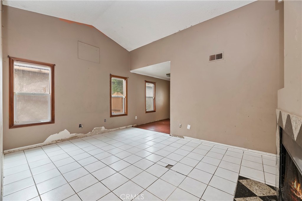 1959 Thornton Street Riverside, CA 92507 - Photo 10 of 26 a view of an empty room with window and chandelier