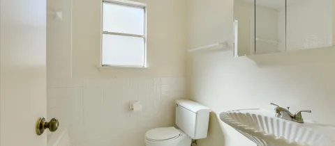 a view of an empty room with windows