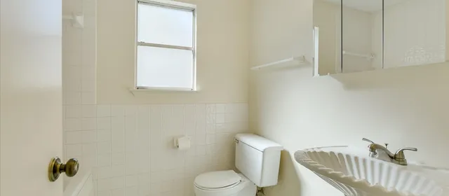 a view of an empty room with windows