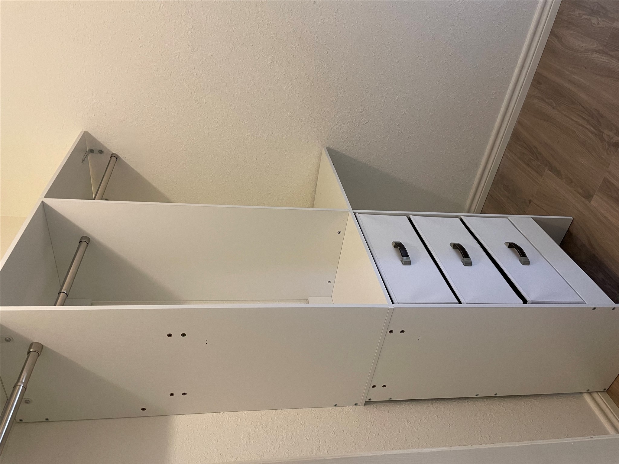 3908 Holt Drive Austin, TX 78749 - Photo 17 of 22 Walk in closet in primary bedroom with wood-type flooring & new organizers