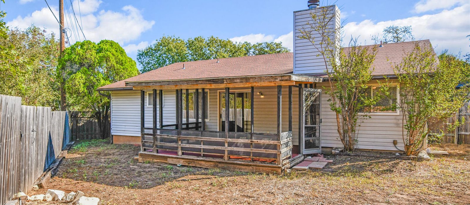 3908 Holt Drive Austin, TX 78749 - Photo 18 of 21 a view of a house with a small yard and wooden fence