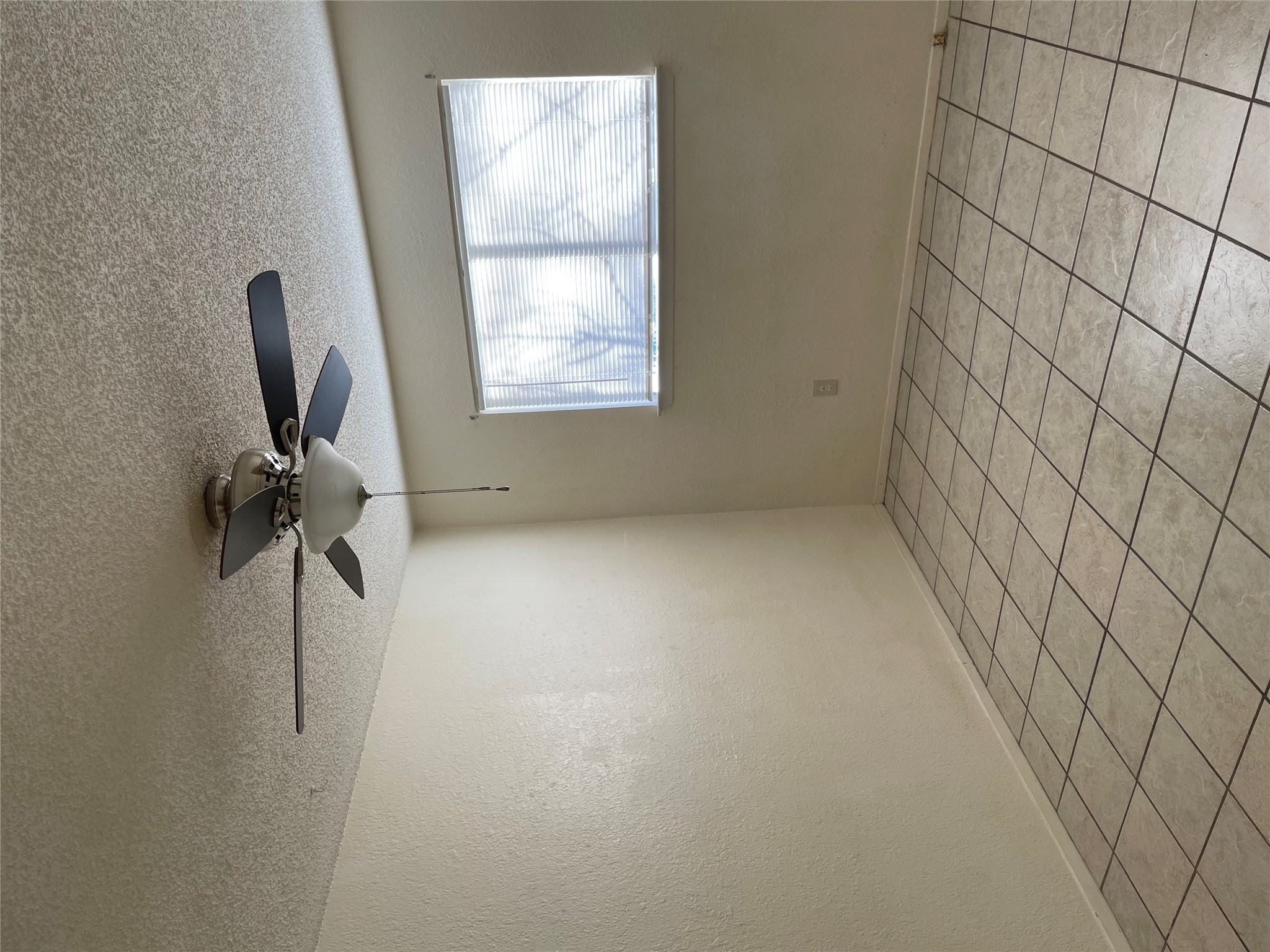 3908 Holt Drive Austin, TX 78749 - Photo 18 of 22 Bedroom featuring new ceiling fan, closet, natural light and light tile flooring