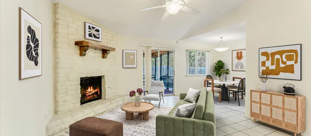 a living room with furniture and fireplace
