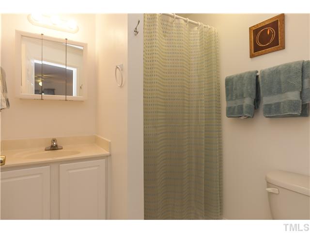 702 Van Buren Road Raleigh, NC 27604 - Photo 13 of 18 Updated master bath with vanity and medicine cabinet storage.