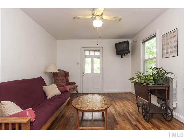 702 Van Buren Road Raleigh, NC 27604 - Photo 3 of 18 The living room is light and bright with gorgeous hardwood floors!
