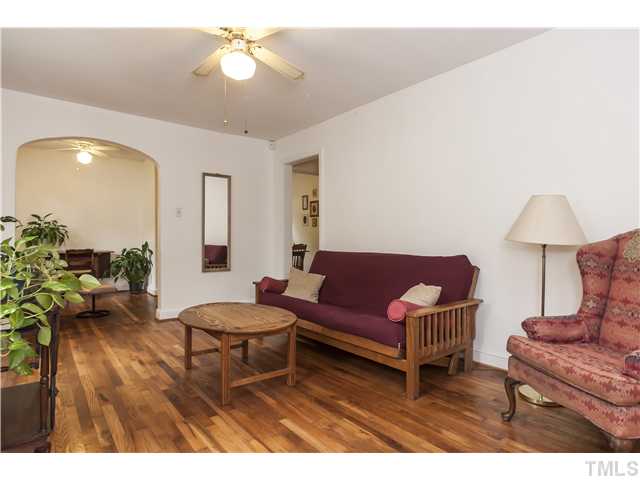 702 Van Buren Road Raleigh, NC 27604 - Photo 4 of 18 Total comfort in this lovely living space, open to the sitting room beyond.