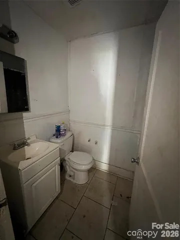 a bathroom with a toilet and a sink