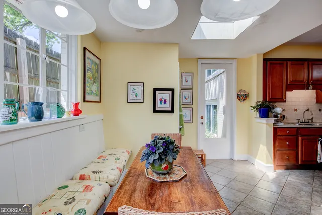 a hallway with furniture and wooden floor