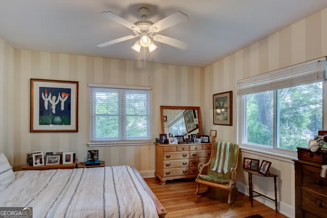 a bedroom with furniture and a window