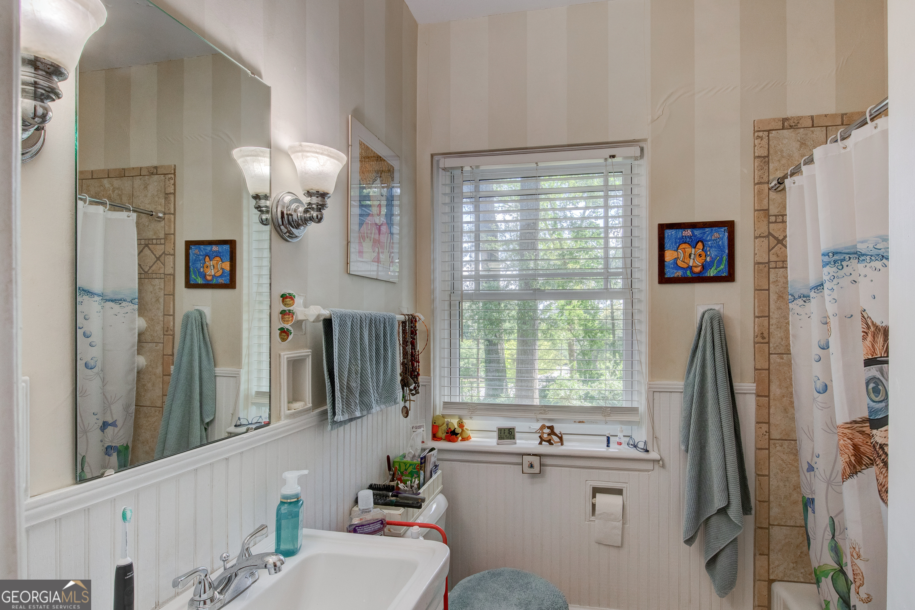 31 Notasulga Drive Rome, GA 30161 - Photo 21 of 38 a bathroom with sink a window and a mirror