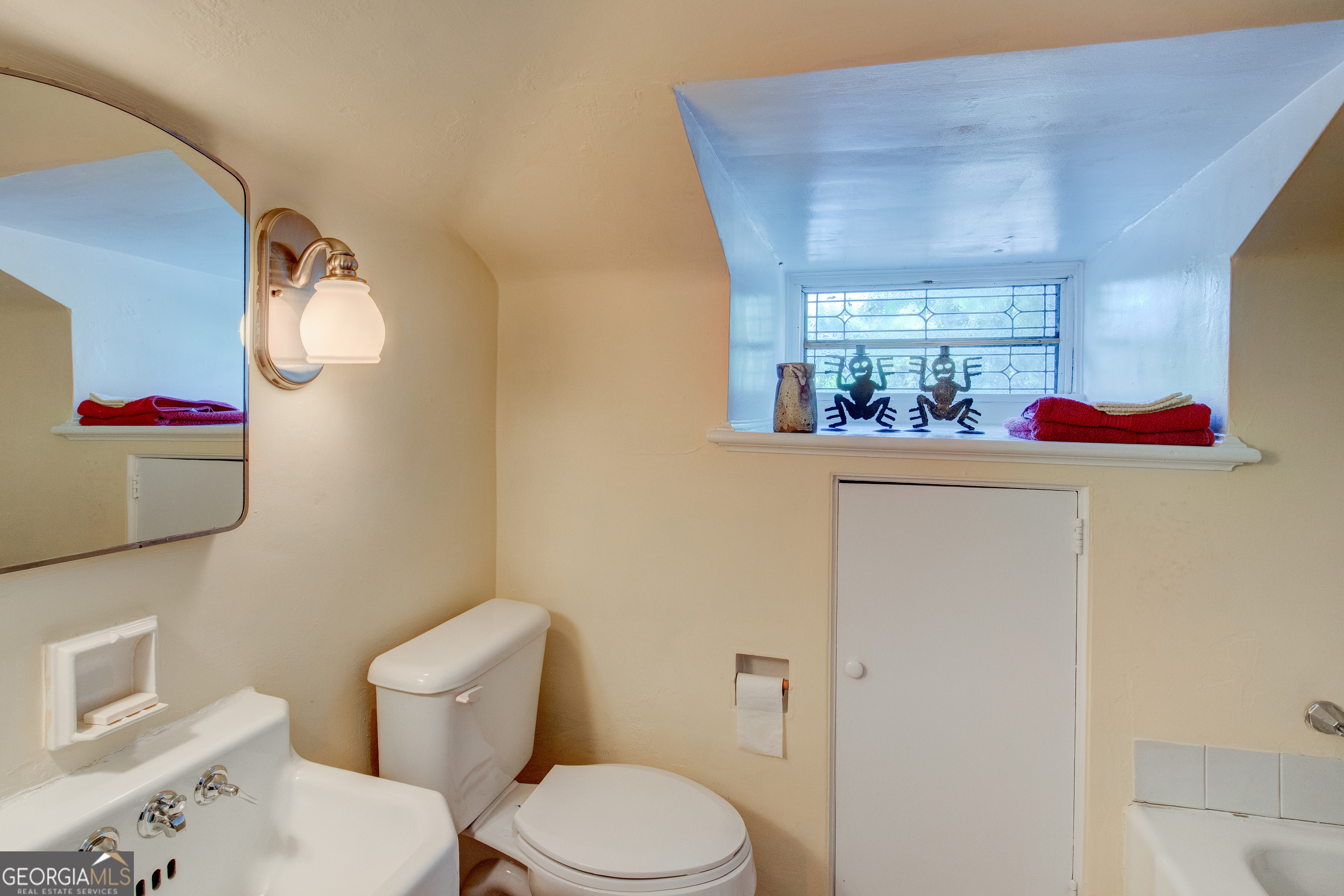 31 Notasulga Drive Rome, GA 30161 - Photo 26 of 38 a bathroom with a toilet sink and mirror