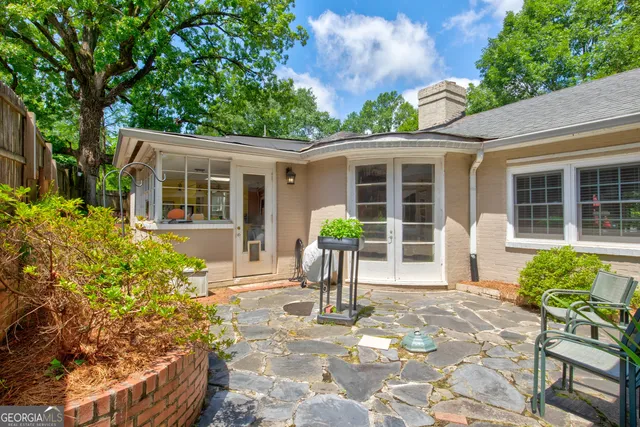 a patio with tables and chairs
