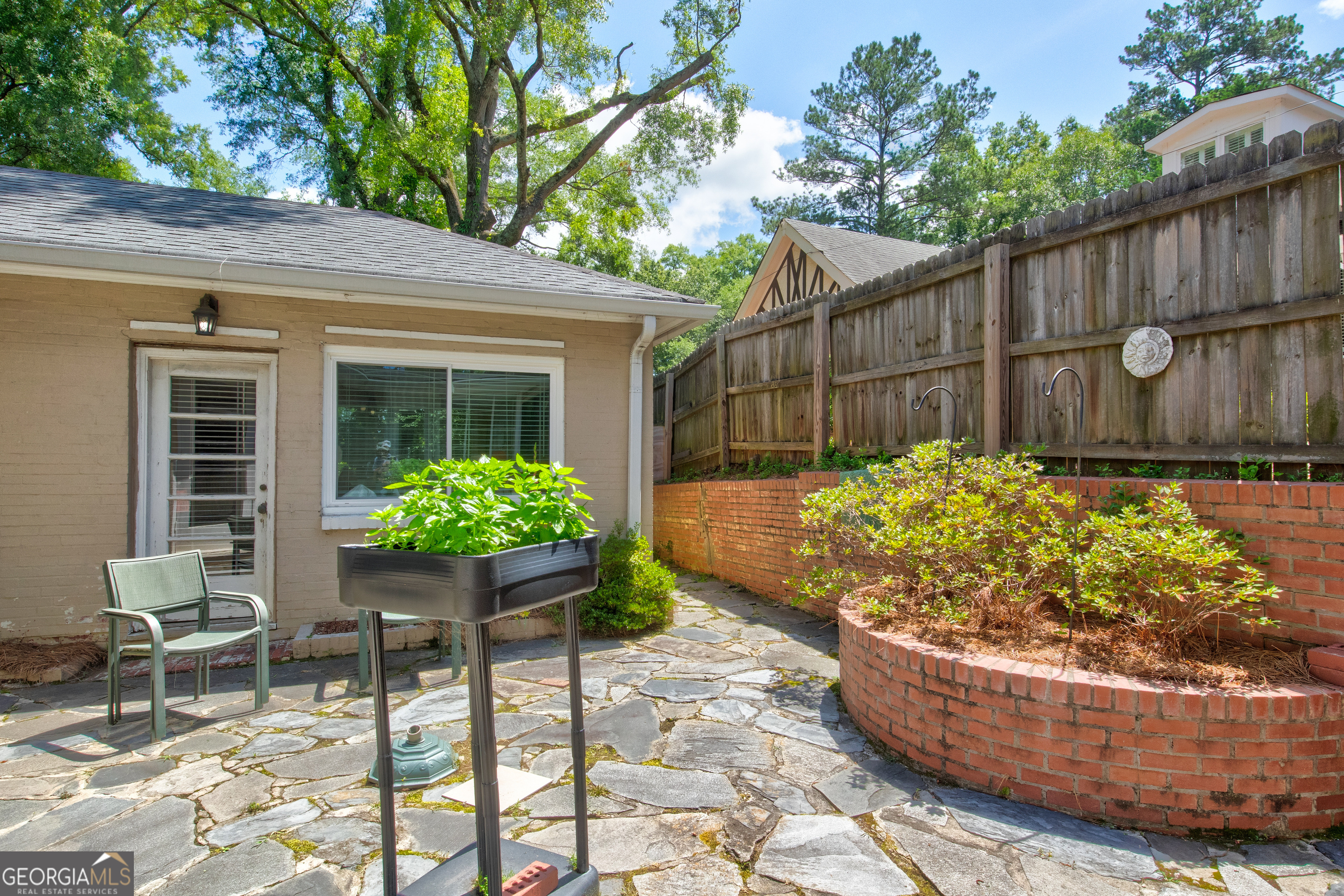 31 Notasulga Drive Rome, GA 30161 - Photo 28 of 38 a view of a backyard with chair and potted plants