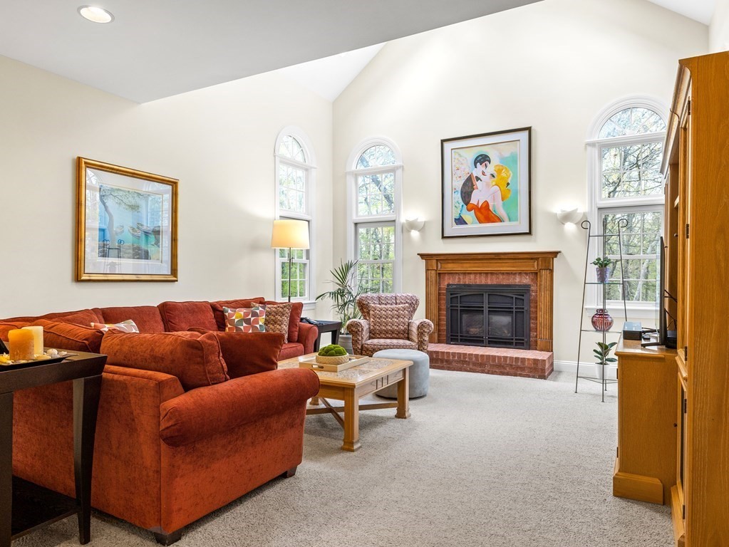 14 Moccasin Path Natick, MA 01760 - Photo 11 of 34 a living room with furniture and a fireplace