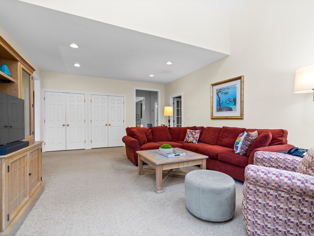 14 Moccasin Path Natick, MA 01760 - Photo 12 of 34 a living room with furniture and a flat screen tv