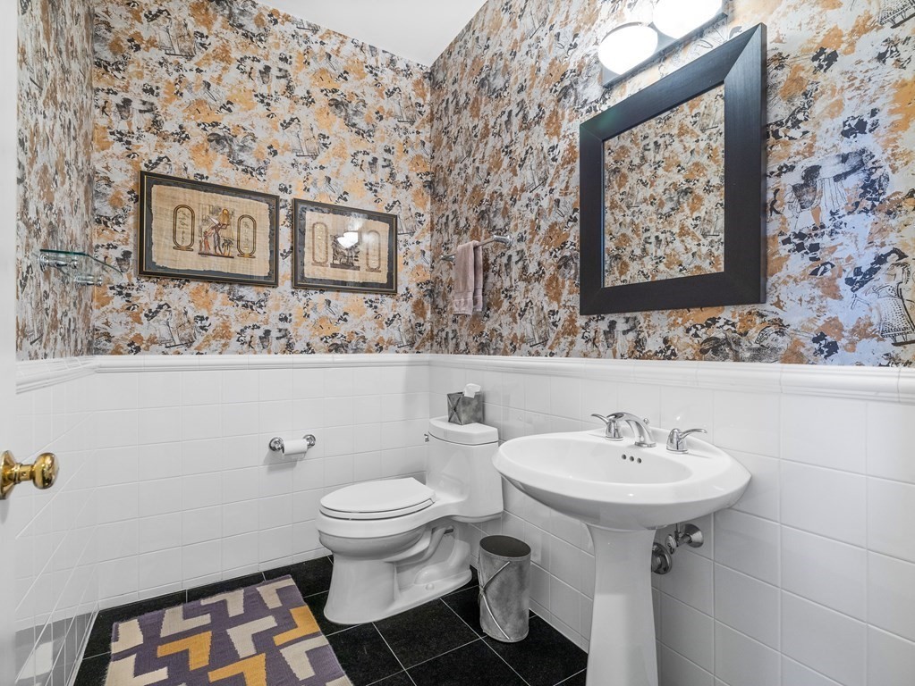 14 Moccasin Path Natick, MA 01760 - Photo 16 of 34 a bathroom with a sink and a mirror