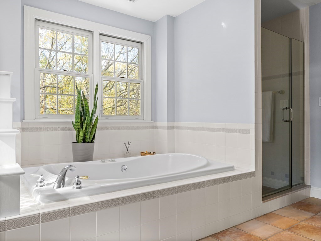 14 Moccasin Path Natick, MA 01760 - Photo 20 of 34 a bathroom with a bathtub and a sink