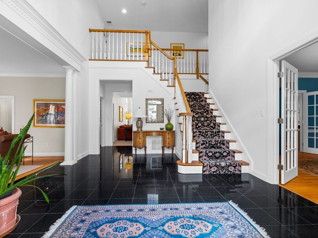14 Moccasin Path Natick, MA 01760 - Photo 2 of 34 a living room with furniture and a rug