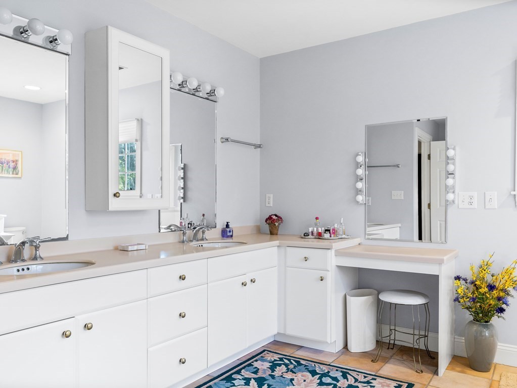 14 Moccasin Path Natick, MA 01760 - Photo 21 of 34 a bathroom with a sink and a mirror