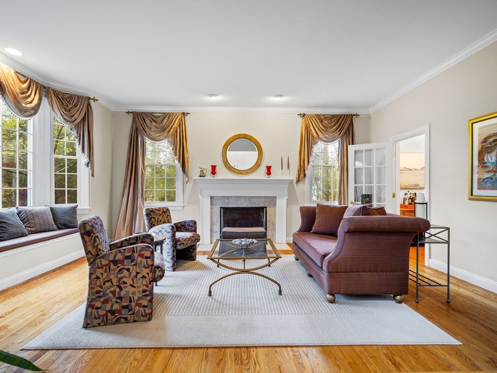 14 Moccasin Path Natick, MA 01760 - Photo 3 of 34 a living room with furniture and a fireplace