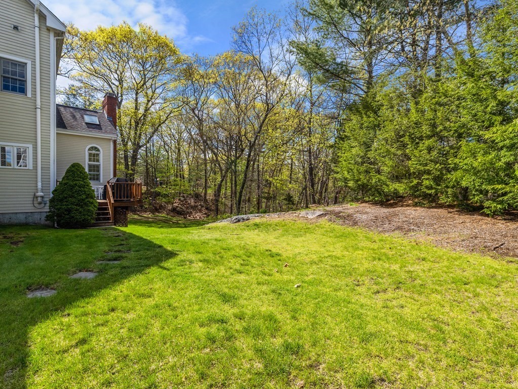 14 Moccasin Path Natick, MA 01760 - Photo 32 of 34 a view of a backyard with a garden