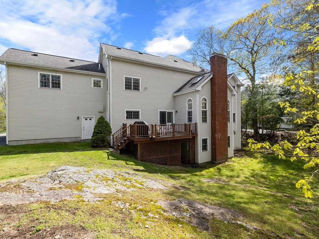 14 Moccasin Path Natick, MA 01760 - Photo 33 of 34 a view of a backyard with plants and a tree