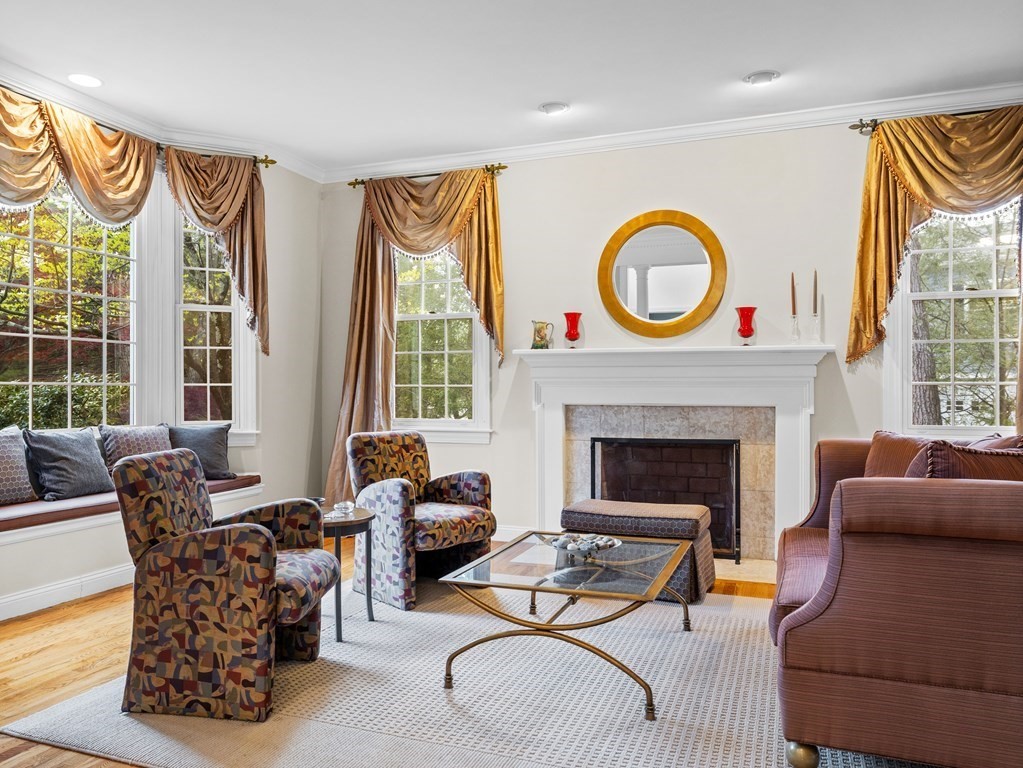 14 Moccasin Path Natick, MA 01760 - Photo 4 of 34 a living room with furniture and a fireplace