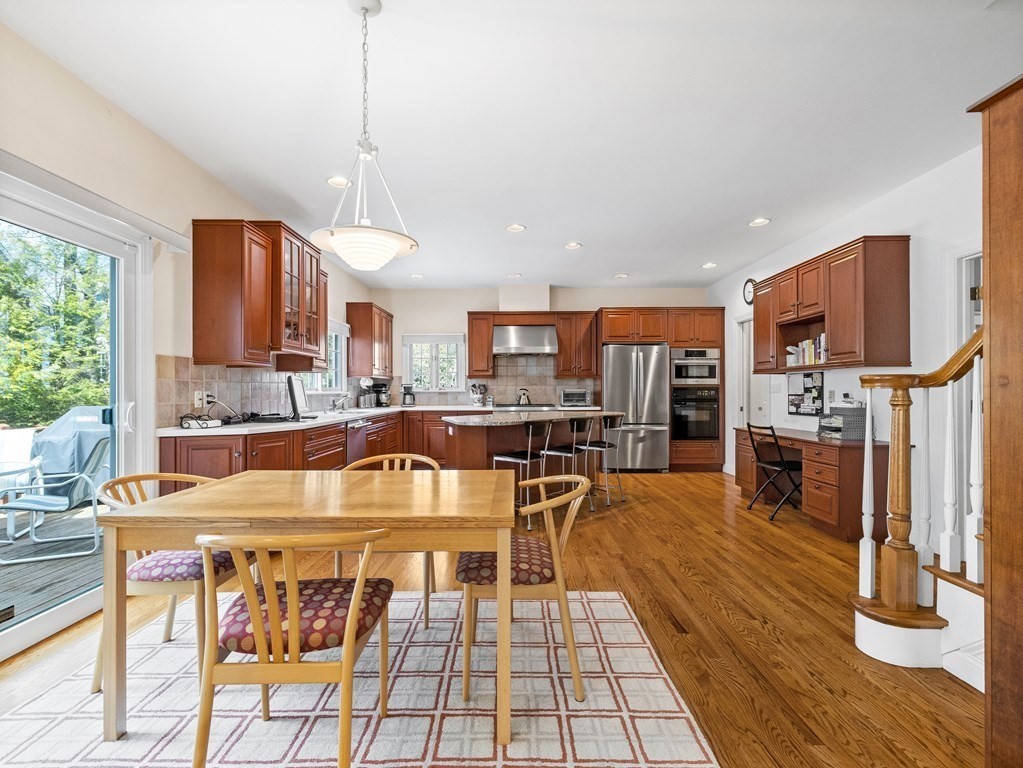 14 Moccasin Path Natick, MA 01760 - Photo 6 of 34 a dining table chair and fireplace