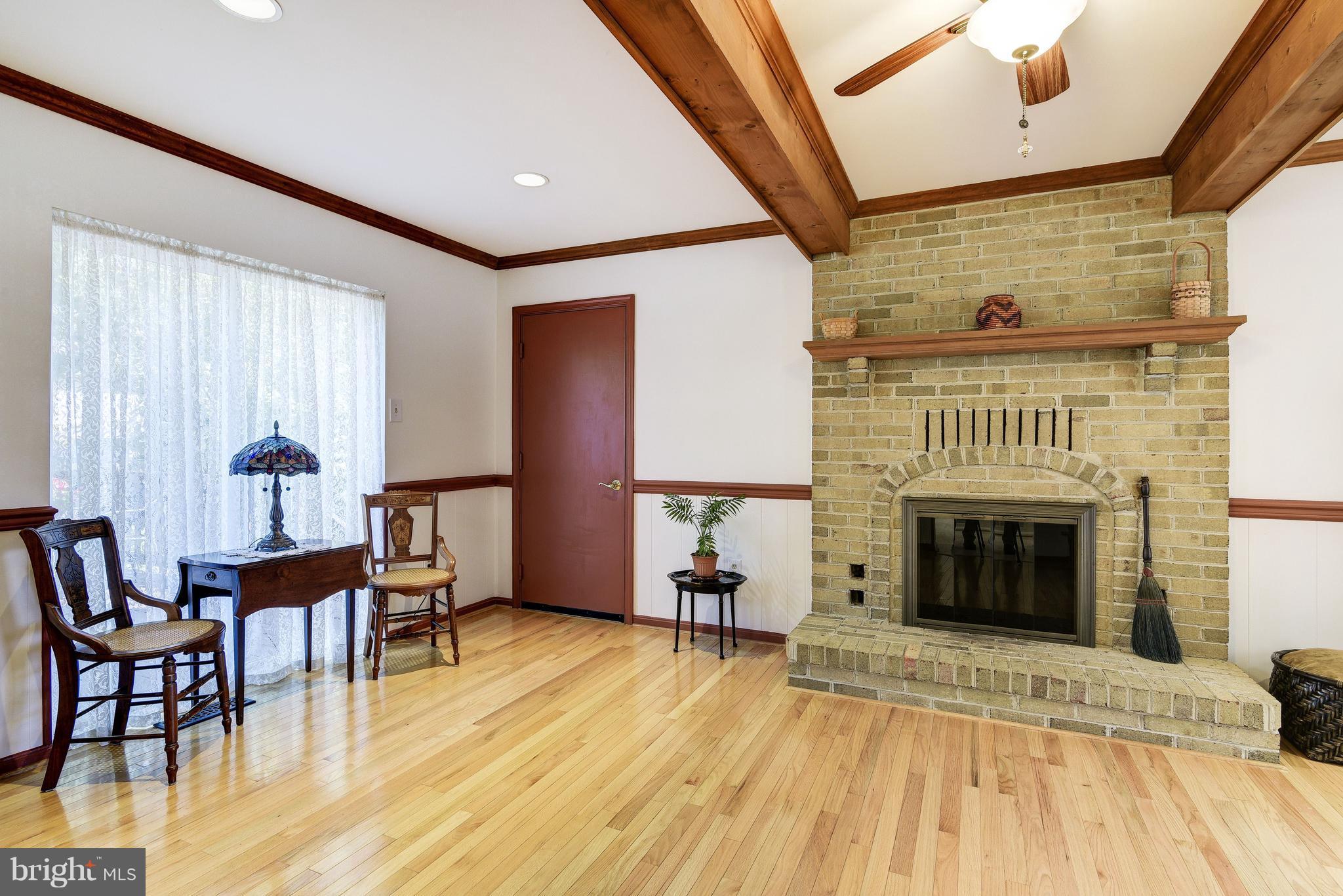 905 Pointer Ridge Drive Gaithersburg, MD 20878 - Photo 14 of 30 a living room with furniture and a fireplace