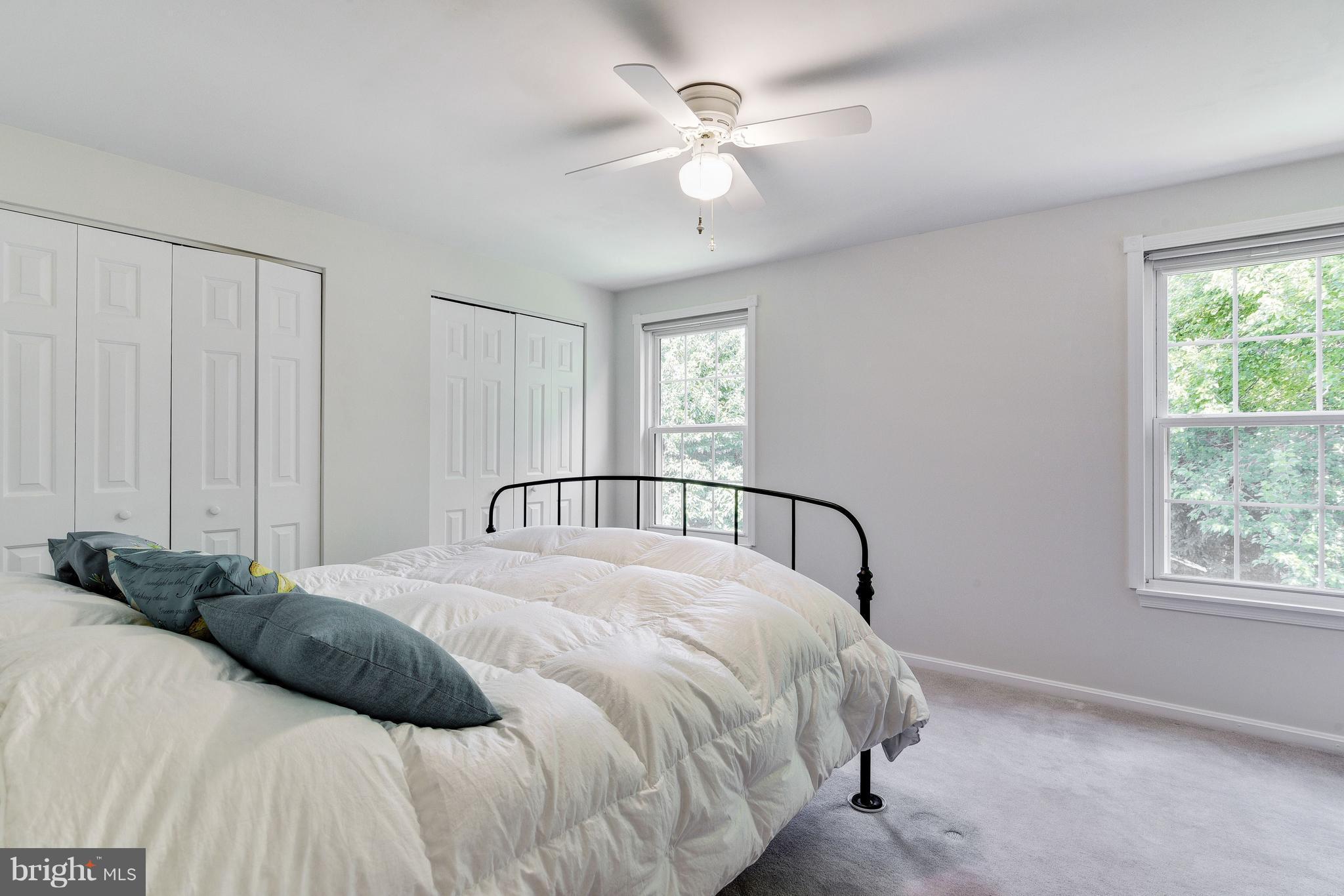 905 Pointer Ridge Drive Gaithersburg, MD 20878 - Photo 22 of 30 a bedroom with a large bed and a window